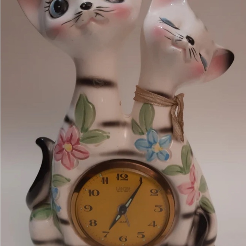 Charming Cat Clock with Floral Accents